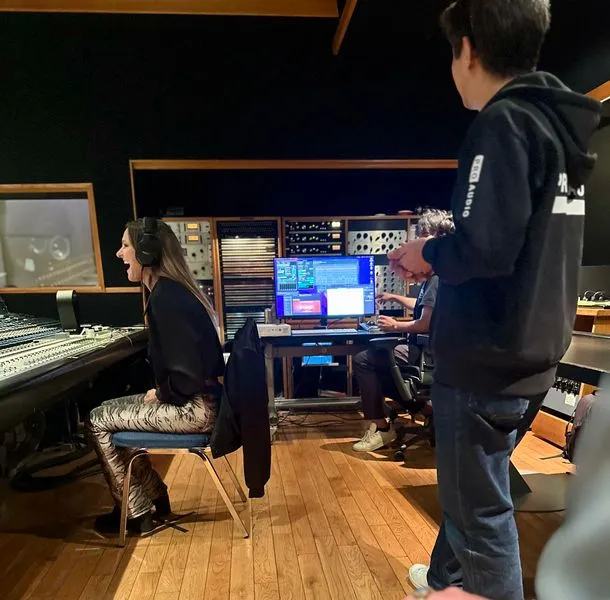 Listeners at a mixing console during a Sony 360 Reality Audio demo